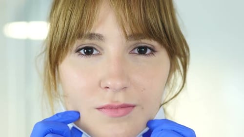 Close Up of Female Reseach Scientist Doctor Wearing Mask