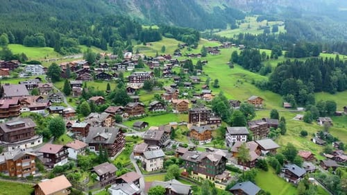 Picturesque Rural Village Nestled in Green Mountain Landscape