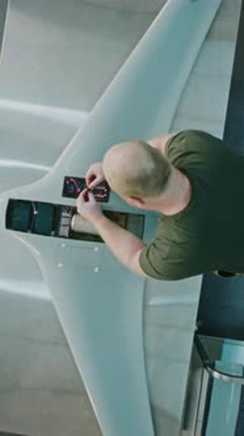 Worker Assembling Drones For National Security