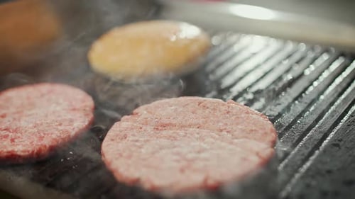 Street Food the Process of Cooking a Burger Meat and Bun are Fried on the Grill Burger Ingredients