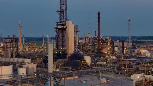 Aerial view of Cenovus Toledo Refinery showing towers and piping systems at dusk