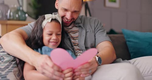 Loving Father Embraces Daughter with Heart Card Gift