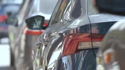 City Traffic with Cars Parked in Line on Street Side
