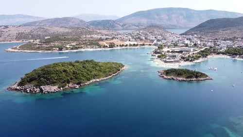 Cityscape, Coastline and Small Beach at Ksamil Islands, Albania - Reversing Aerial