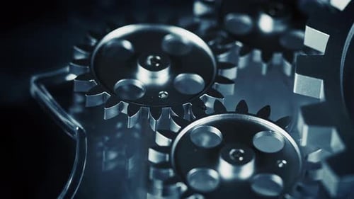 Metallic Gears Rotating in Blue Toned Close-up