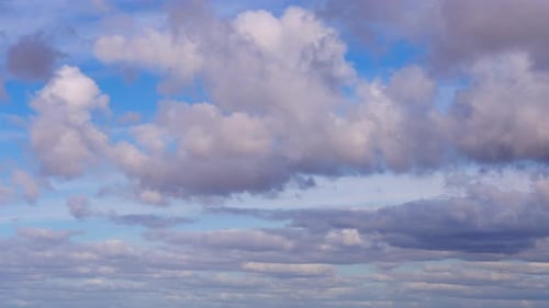Dramatic Clouds Moving Across a Blue Sky