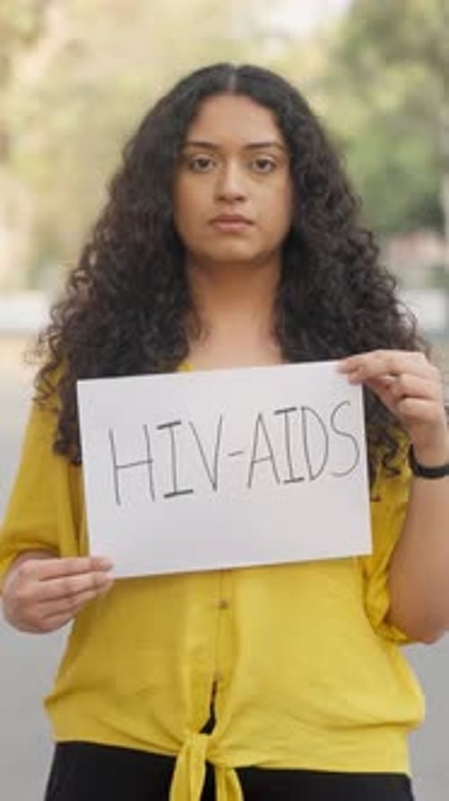 Young Woman Holding an HIV-AIDS Awareness Sign