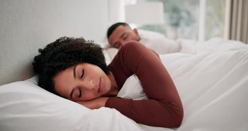Couple Sleeping Peacefully in Bright Bedroom