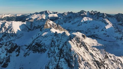 Stunning aerial view of the snowy Alps showcasing majestic mountain peaks