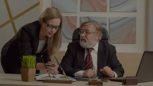 Successful Diverse Managers with Laptop Analyzing Company Finance at Office