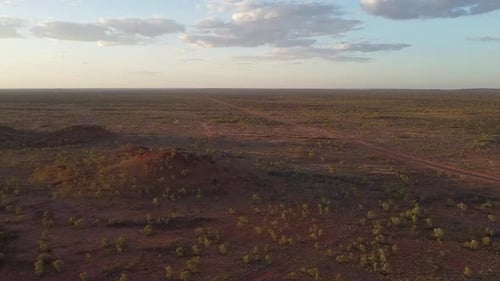 Aerial Shot of a Car Driving Down a Solitary Road in the Outback.
Location: Barkly Tableland, Northe