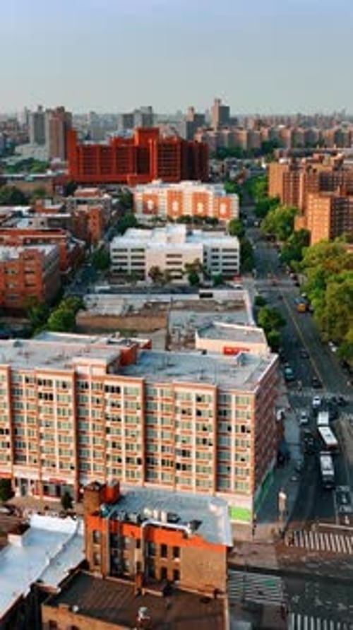 Neighborhoods of New York on sunny daytime. Top view on the residential areas at sunset