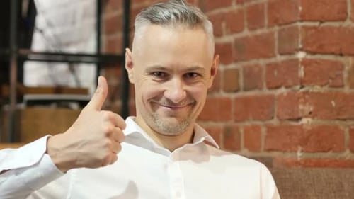 Thumbs Up By Middle Age Man