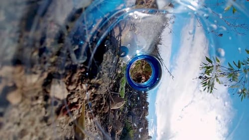 Plastic Bottle View of Rocky Terrain and Sky