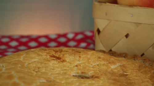 Delicious apple pie pie on a red and white checkered cloth