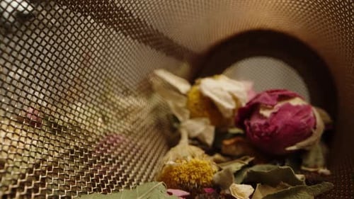 Close Up of Tea Infuser with Dried Herbs