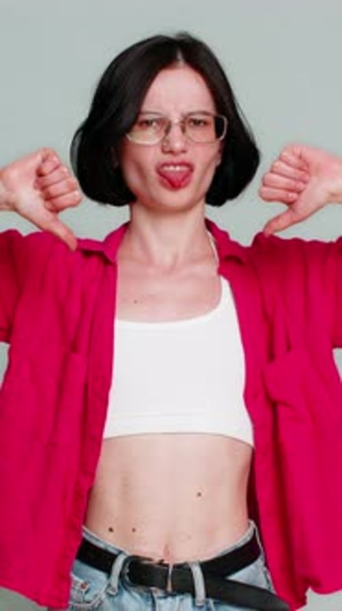 Woman Disapproving and Giving Thumbs Down