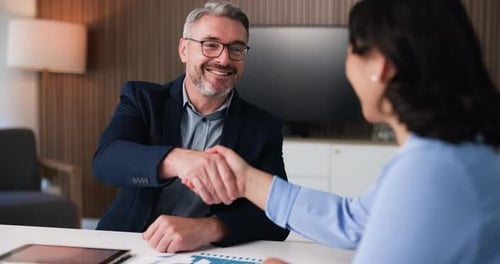 Happy, business people and meeting with handshake for partnership, deal or agreement in office