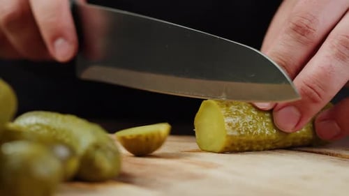 Chef Slicing Salted Pickles with Knife From Jar Can Cucumbers Preservations Conservation Salted