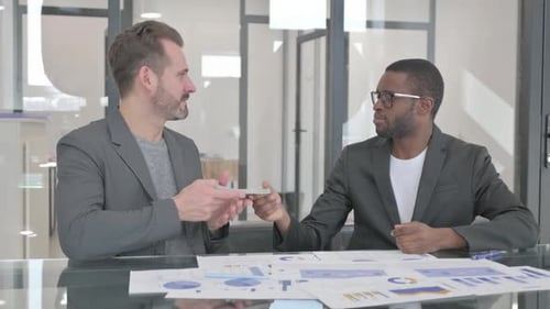 African Man Giving Money and Shaking Hand