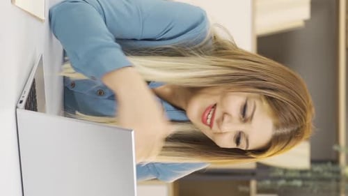 Woman Working on Laptop in Office, Portrait