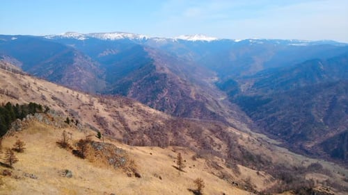 Majestic Mountain Range with Snow Capped Peaks in Spring Media