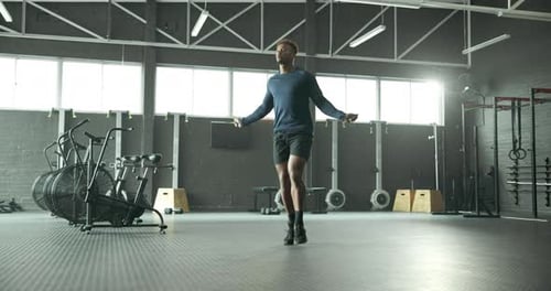 Jump, skipping rope or black man in gym for fitness for body health, training