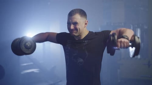 Man Lifting Weights at the Gym