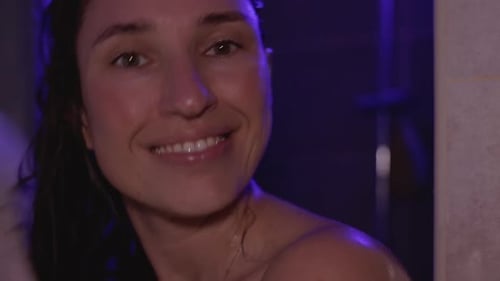Smiling Woman Drying Hair with Towel in Shower