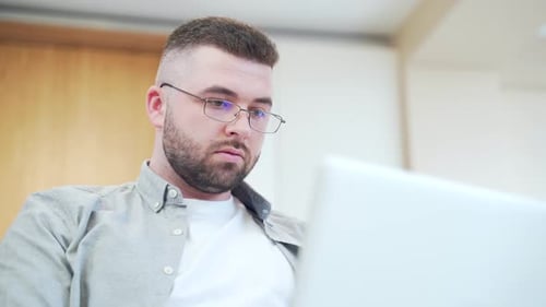 Man Using Laptop Computer Indoors