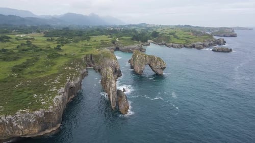 Aerial view of Asturias coastline. Drone shot of sea, cliff, rocks and the Atlantic ocean in Spain.