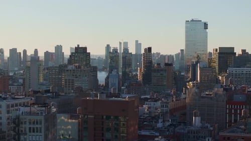 Golden Sunlight Bathing Manhattan Skyline Highlighting Architectural Majesty From Elevated Viewpoint