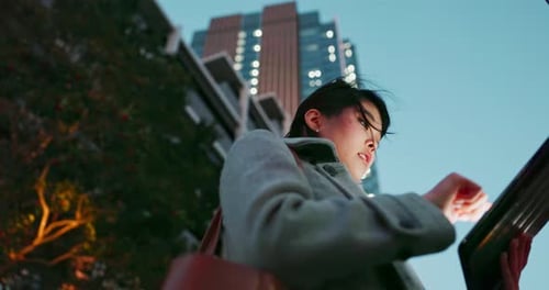 Tablet, city and Japanese business woman reading a blog on website or internet