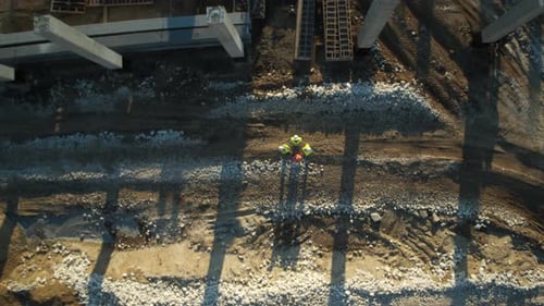 An Aerial View Capturing Construction Workers Collaborating Effectively on the Site