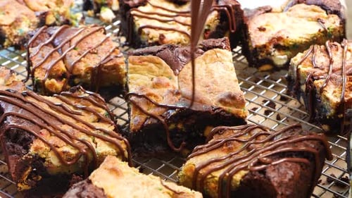 Baking brownies with added confetti sugar cookies, called a Brookie. Close up and panning across bro
