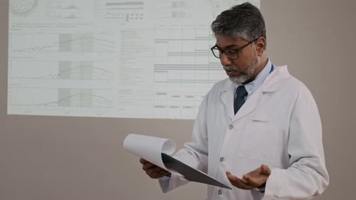 Professional Man Explaining Charts and Graphs