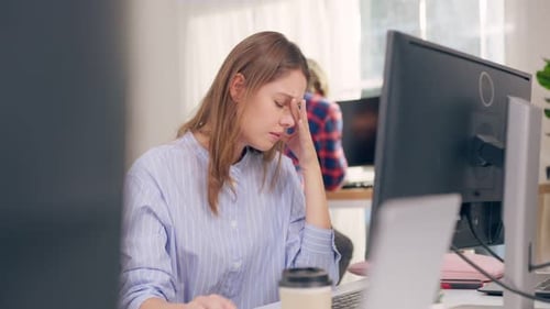 Frustrated Caucasian businesswoman overwork late in office workplace.