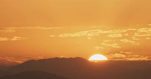 Majestic Sunrise over Mountain Range Time Lapse