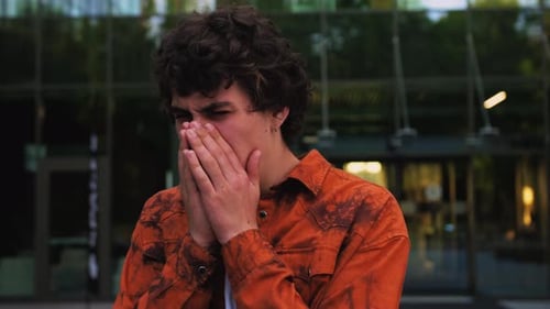 Young Caucasian Man Coughing and Sneezing Standing Outdoor Choked or Suffering Asthma Sick Feeling