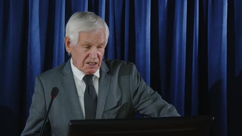 Man Giving a Speech at a Podium