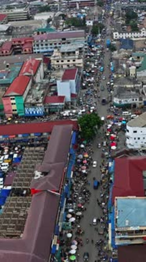 Crowd of people and cars at Accra Central Market