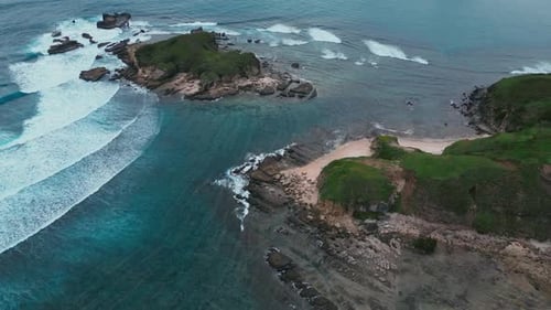 Cliffs Meet Ocean Seaside Cliffs With Crashing Waves And Vibrant Coral Bands