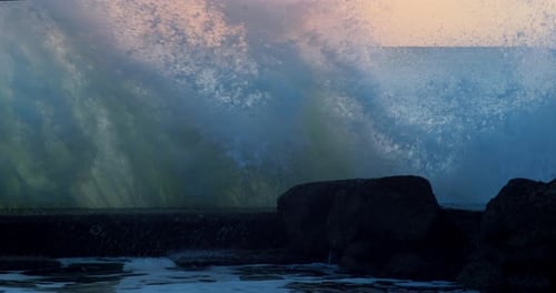 Waves hitting rocks by the seashore