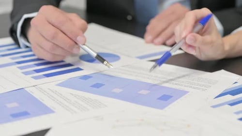 Close up of Business People Working on Documents