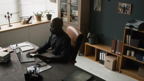 Man Working at a Desk in an Office