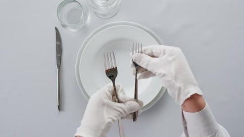Fancy Restaurant Waiter Elegant Table Setting with White Square Plate and Silverware Arranged for
