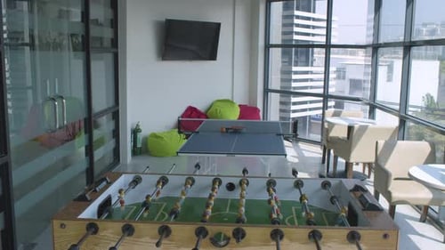 Panning Shot Of A Modern Corporate Office Game Room
