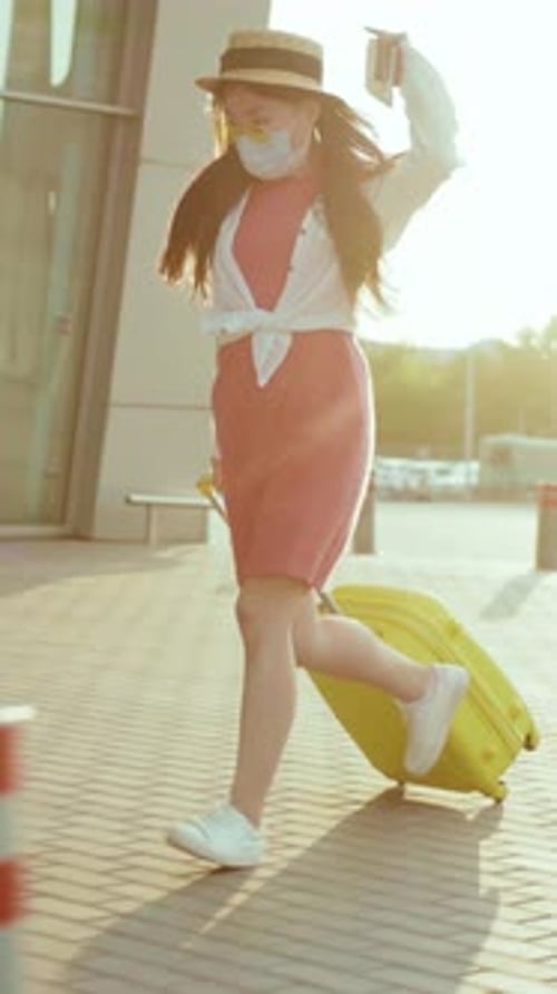 Woman Runs with Suitcase to Airport