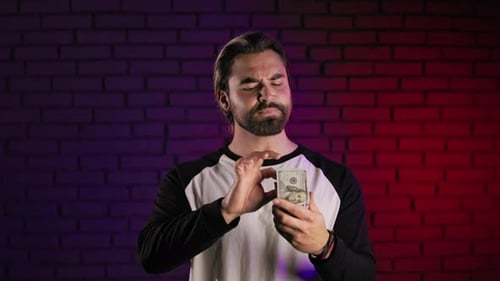 Happy Guy Counting Money Cash in Dollars Indoors