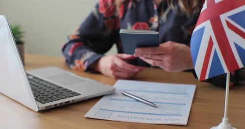 Applying for a UK Visa with Laptop and Passport